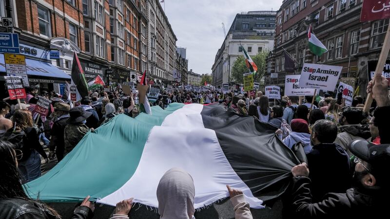 People take part in a pro-Palestine march in central London