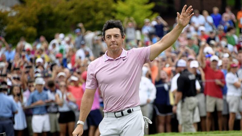 Rory McIlroy waves to the gallery after winning the Tour Championship golf tournament and The FedEx Cup