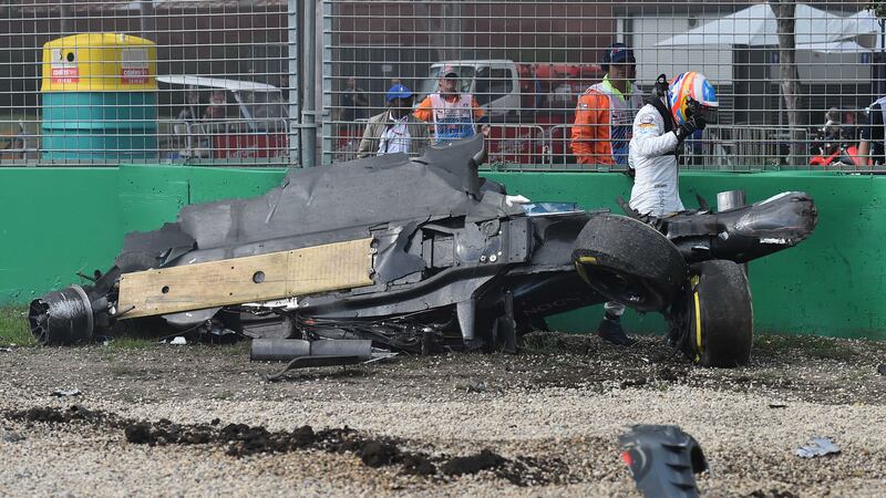 McLaren driver Fernando Alonso emerges from the wreck of his car after he collided with Haas driver Esteban Gutierrez during the Australian Grand Prix in Melbourne on Sunday<br />Picture by AP&nbsp;