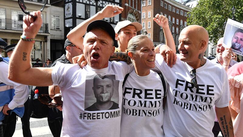 Supporters of Tommy Robinson celebrate outside the Royal Courts of Justice in London, where the former English Defence League (EDL) leader has been freed on bail by the Court of Appeal after winning a challenge against a finding of contempt of court&nbsp;