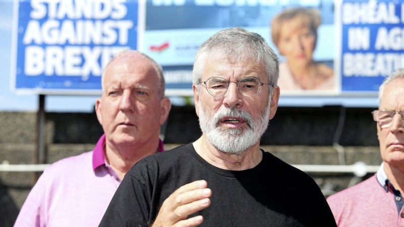 Gerry Adams speaks to the media following an attack on his and Bobby Storey's homes in west Belfast. Picture Mal McCann.