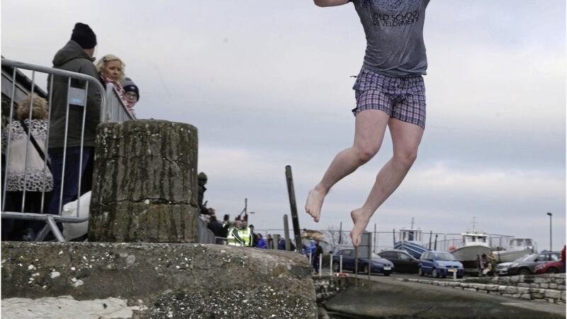Declan Mallon at the annual charity New Year&#39;s Day plunge at Carnlough Harbour. Picture by Hugh Russell 