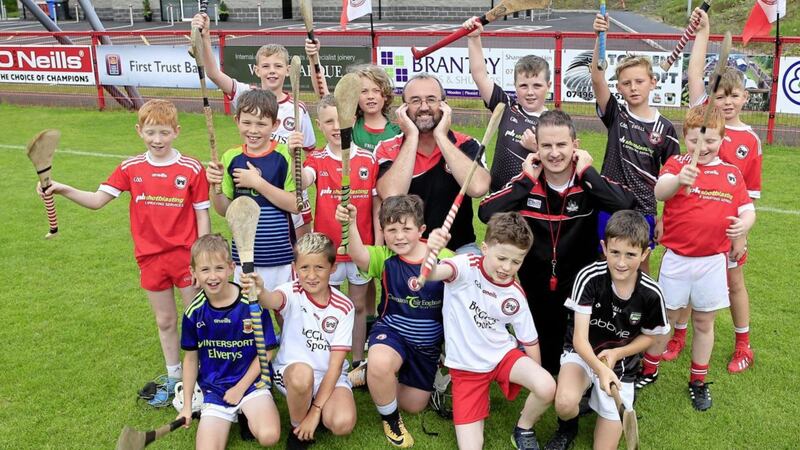 Under-10s from Eoghan Ruadh Hurling Club in Dungannon with club chairman Tomas Colton and youth officer Cathal McErlean. Picture by Philip Walsh 