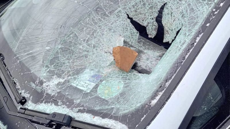 A brick was thrown through the windscreen of the car 