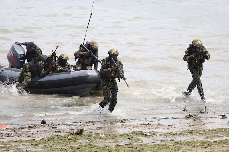 Kenyan Marines demonstrate a covert beach landing, showing defence collaboration in action, during a visit by the King, as Captain General of the Royal Marines, and Queen Camilla to Mtongwe Naval Base in Mombasa 