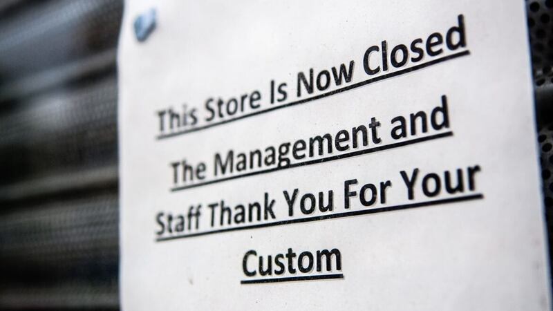 Sign advising customers that &quot;This store is now closed. The management and Staff thank you for your custom&quot; 