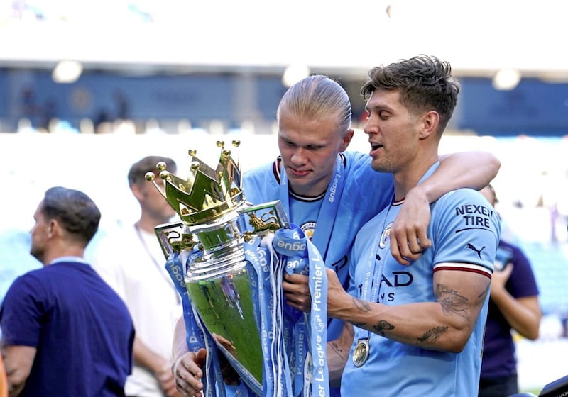 Manchester City signed super striker Erling Haaland (left) and have used John Stones in an innovative new hybrid role.
