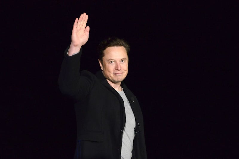 Elon Musk waves