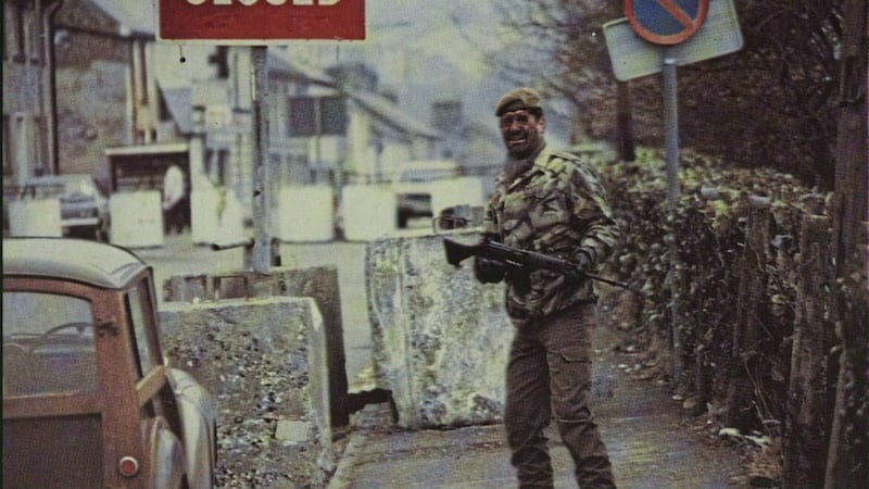 A British soldier in Newtownhamilton in south Armagh in 1979, with a &#39;road closed&#39; sign and huge cement block obstructions. Picture from Illustrated London News 