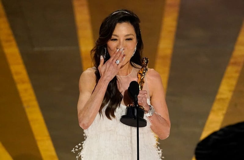 Michelle Yeoh accepts the award for best performance by an actress in a leading role for Everything Everywhere All at Once (Chris Pizzello/AP)