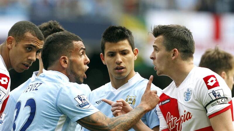 Joey Barton (right) was initially sent off for clashing with Manchester City’s Carlo Tevez (Peter Byrne/PA)