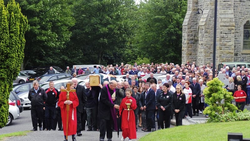 Michael McManus&#39;s remains are carried form Holy Cross Church in Lisnaskea earlier this week  