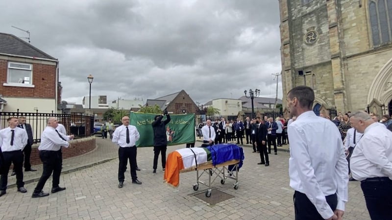 A picture posted on Twitter appeared to show a man firing a volley of shots over the coffin of Belfast man James McWilliams
