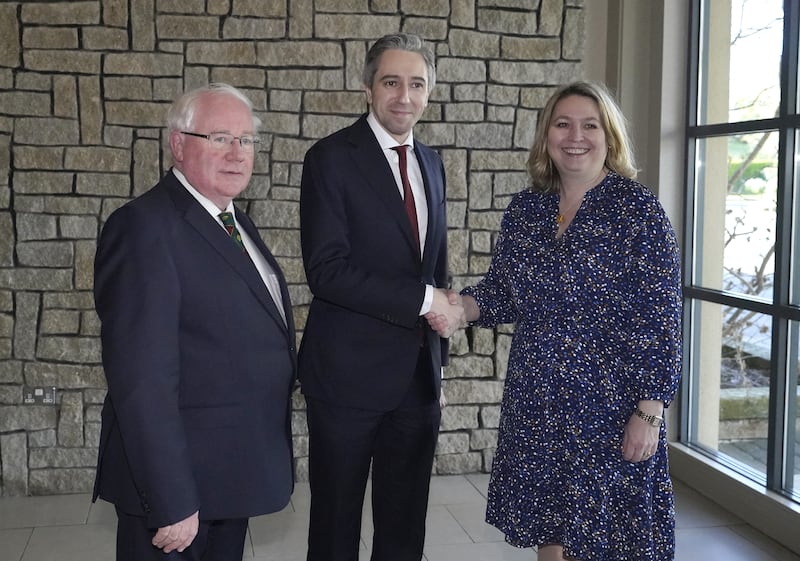 Taoiseach Simon Harris is met by Brendan Smith and Dame Karen Bradley before he addresses the British-Irish Parliamentary Assembly at Druids Glen Hotel in Co Wicklow