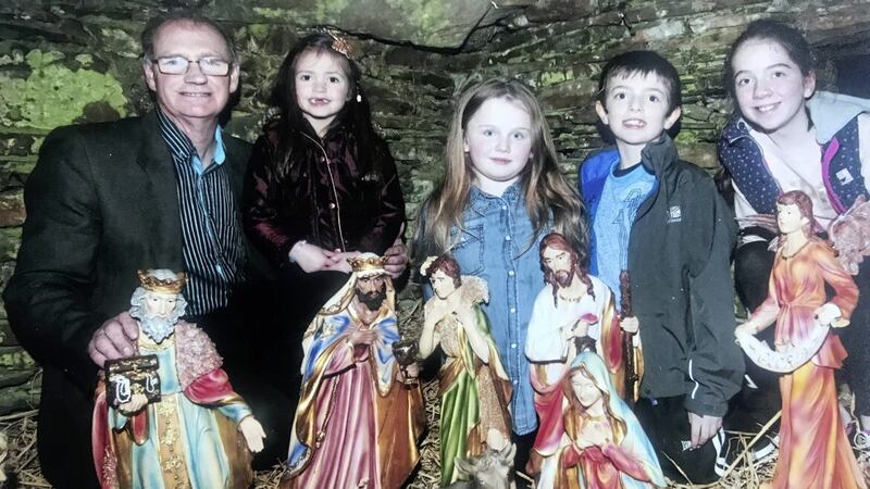 John McIlmail welcomes just some of the children who have visited the nativity scene at his family farm at Bright, outside Downpatrick. Picture by Philip Walsh 