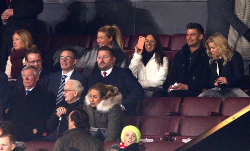 The group in the stands with Sir Alex Ferguson (left) and Manchester United group managing director Richard Arnold (centre)