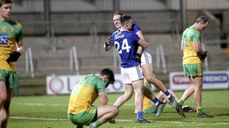 Cavan players celebrate as the whistle brings an end to a dramatic 2020 Ulster Senior Football Championship final and victory over favourites Donegal. Paddy Heaney&#39;s not in the mood for joining in the celebrations. Picture by Seamus Loughran. 
