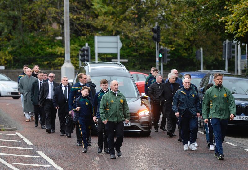 The funeral of Hugh Russell as it made its way to St Patrick's Church flanked by members of the Holy Family Boxing club. Picture by Mark Marlow