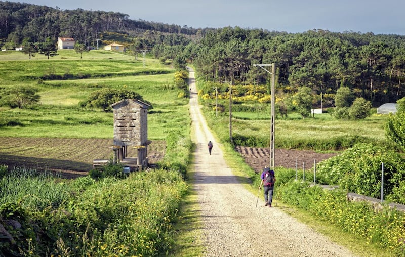 Pilgrims walking along on the Way of St. James, Muxia-Fisterra, Galicia, Spain  