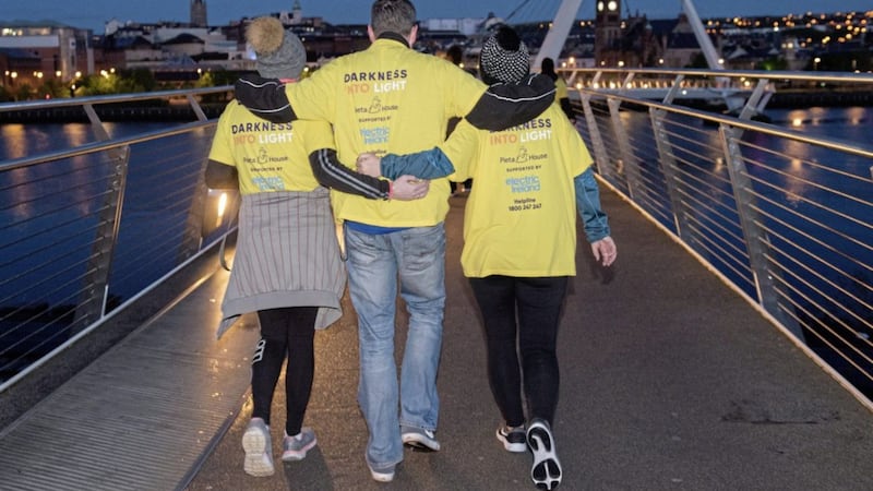 People from Derry at the Darkness Into Light event in the city along the banks of the River Foyle and across the iconic Peace Bridge. The event was organised by Pieta House and supported by Electric Ireland