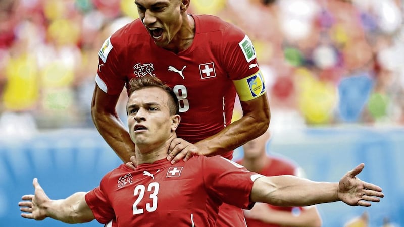 Switzerland star Xherdan Shaqiri (23) celebrates scoring at the last World Cup against Honduras with teammate Gokhan Inler. 
