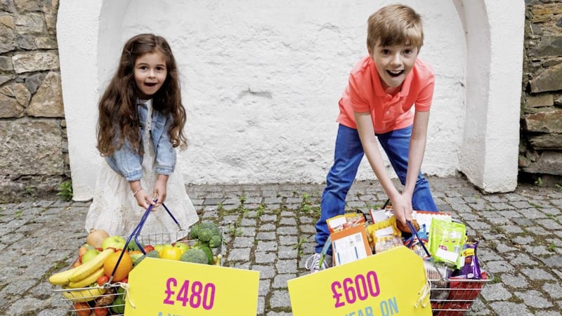 NI families spend on average &pound;600 on treat foods like crisps, chocolate and biscuits per year. Pictured is Meadow Neville (6) and Alexander Bellintani (10) 