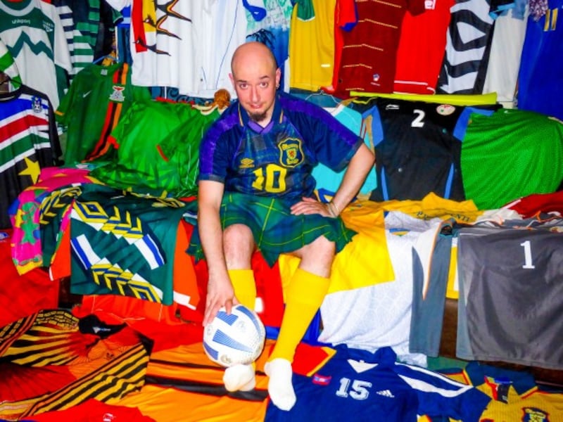 Joe Johnstone with his football shirt collection
