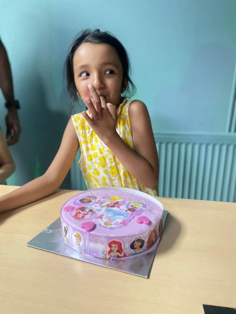 Daya with a Disney princess cake for her 7th birthday