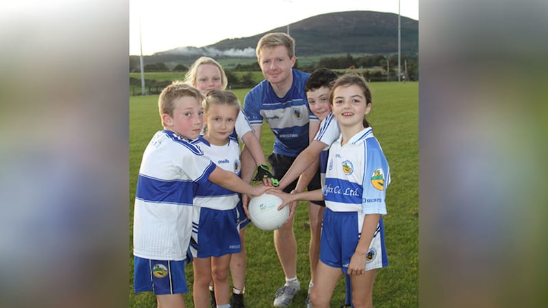 &nbsp;Scott Winters with some of the young players he has been helping to train at Dromintee GAC in Co Armagh