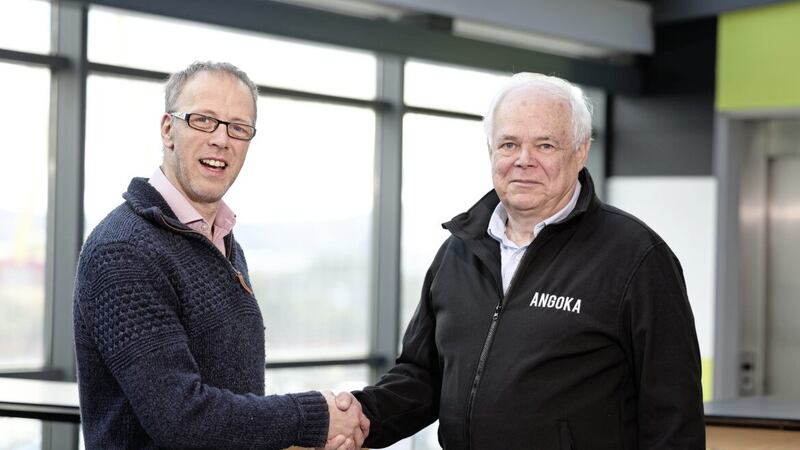 Sealing the acquisition deal are Angoka&#39;s Steve Berry (right) with Clem Robertson from R4DARTech Ltd 