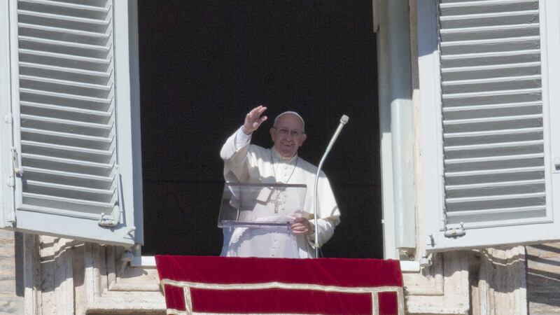 &nbsp;Pope Francis waves to faithful as he delivers the Angelus noon prayer in St Peter's Square at the Vatican on Sunday
