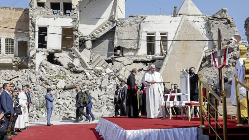 Pope Francis, surrounded by shells of destroyed churches, prays at Hosh al-Bieaa Church Square in Mosul during his visit to Iraq. Picture by AP Photo/Andrew Medichini 