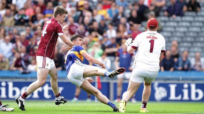Tipperary's Michael Quinlivan gets away from Galway's David Wynne during last Sunday's All-Ireland Senior Football Championship quarter-final at Croke Park.&nbsp;Picture by Colm O'Reilly
