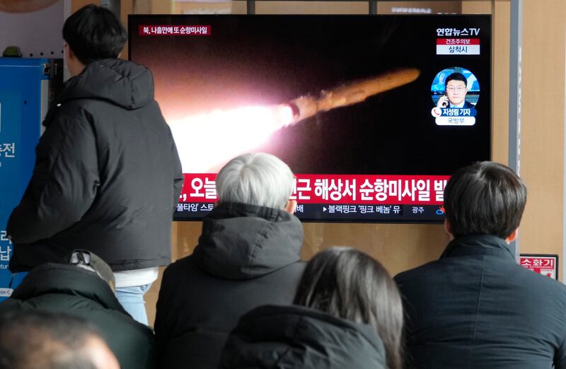 A TV screen shows a file image of North Korea’s missile launch during a news programme at Seoul railway station (Ahn Young-joon/AP)