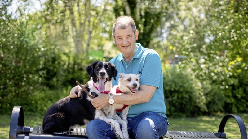 Noel Conlon with his two pet dogs 