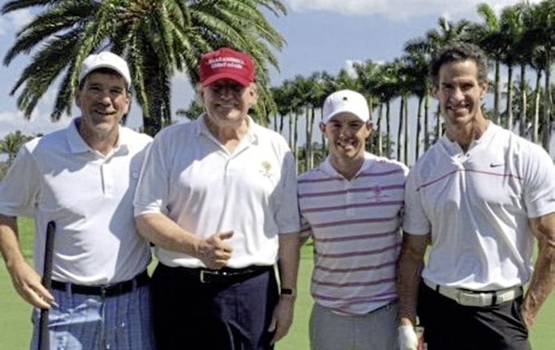 Eric Trump has said Rory McIlroy is a &quot;great friend&quot;. McIlroy, third left, pictured in February with Donald Trump, second left, after a round of golf together 