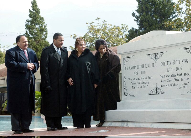 The children of Martin Luther King Jr and Coretta Scott King, from left, Martin Luther King III, Dexter King, Yolanda King and Bernice King stand next to a new crypt dedicated to their parents in Atlanta in 2006 (WA Harewood/AP)