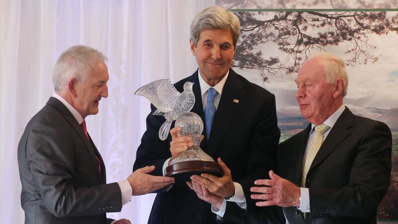 Martin (left) and Joe Quinn (right) present US Secretary of State John Kerry with the Tipperary Peace Prize during a ceremony at the Aherlow House Hotel in Tipperary. Picture by Niall Carson, Press Association