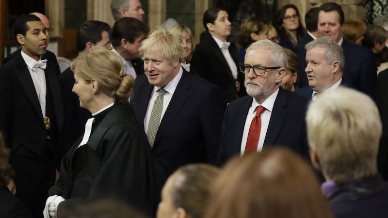 British prime minister Boris Johnson and opposition Labour Party Leader Jeremy Corbyn walk through the Members' Lobby in the House of Commons during the State Opening of Parliament&nbsp;