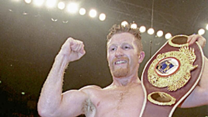 Steve Collins celebrates after retaining his WBO super-middleweight title with a 12-round points win over Cornellius Carr at The Point in Dublin on November 25 1995. Photo by Martin McCullough/PA. 
