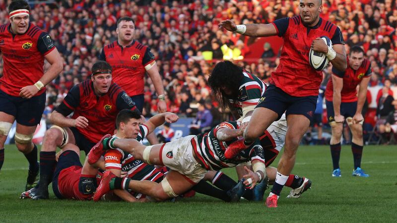 &nbsp;Munster's Simon Zebo breaks through the Leicester defence on the way to scoring his side's first try during the European Champions Cup. Picture by PA