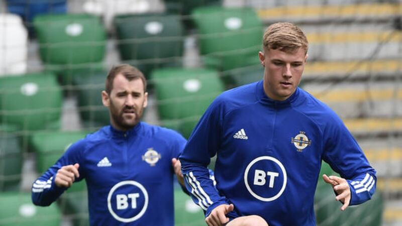Niall McGinn looks on at defender Daniel Ballard during Northern Ireland training at Windsor Park.<br />Pic Colm Lenaghan/Pacemaker&nbsp;