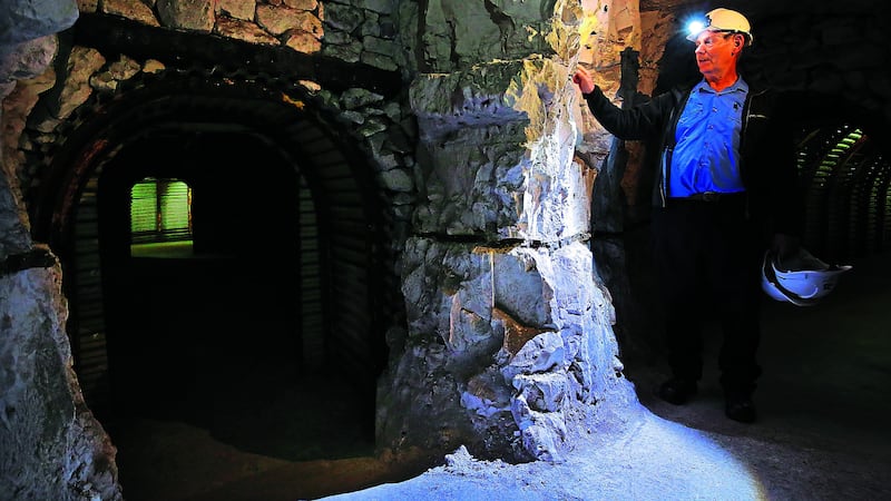 National Trust volunteer Gordon Wise explores the tunnels of the Fan Bay Deep Shelter in Dover, Kent, as they are prepared to be opened to the public following two years of National Trust conservation&nbsp;