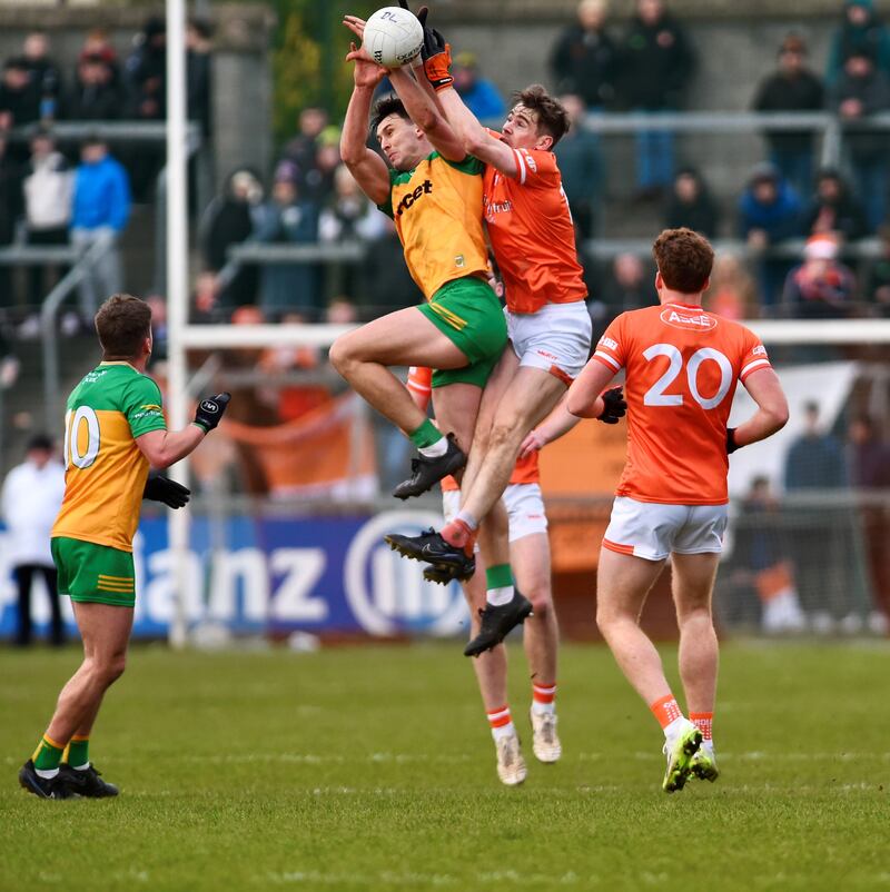 Andy Murnin and Michael Langan compete for a kickout during Armagh's draw with Donegal. Picture: John Merry