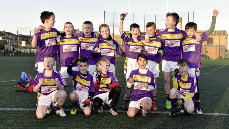 St Clare&rsquo;s PS in west Belfast celebrate their win over Holy Family PS in the Cumann na mBunscol League B football final at Whiterock Leisure Centre. Picture by Mark Marlow 