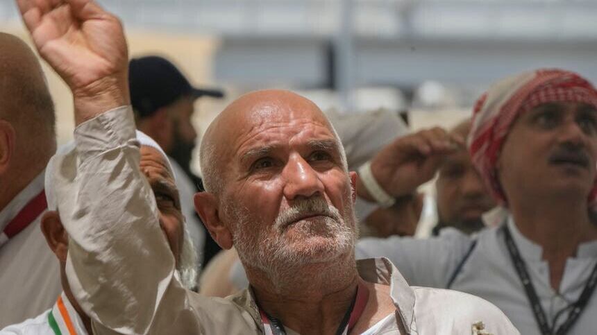 An Iranian pilgrim casts a stone at a pillar in the symbolic stoning of the devil, the last rite of the annual Hajj pilgrimage, in Mina near the holly city of Mecca, Saudi Arabia (Amr Nabil/AP)