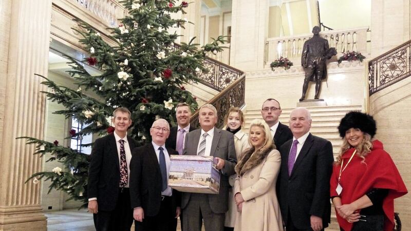 The 300,000-signature petition opposing change to Northern Ireland&#39;s abortion law being presented to the Stormont Assembly by Jim Wells (holding box) and Bernie Smyth (to his left) from Precious Life. Picture by DUP/PA Wire 