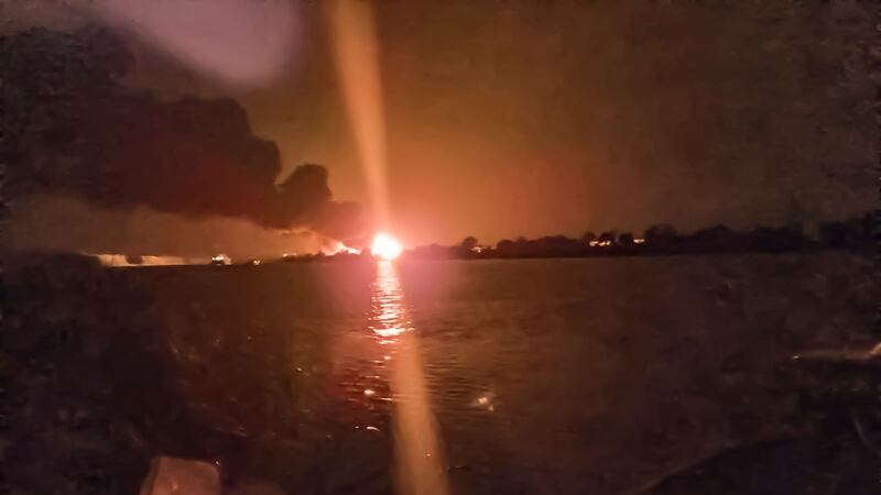 A fireball lights the horizon on the Ukrainian shore of the Danube, as seen from the Romanian side (Mircea Franc via AP)