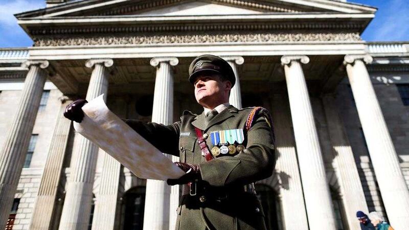 Captain Peter Kelleher reading the Proclamation at the GPO, O&#39;Connell Street, on Easter Sunday. Picture by Maxwells, Press Association 