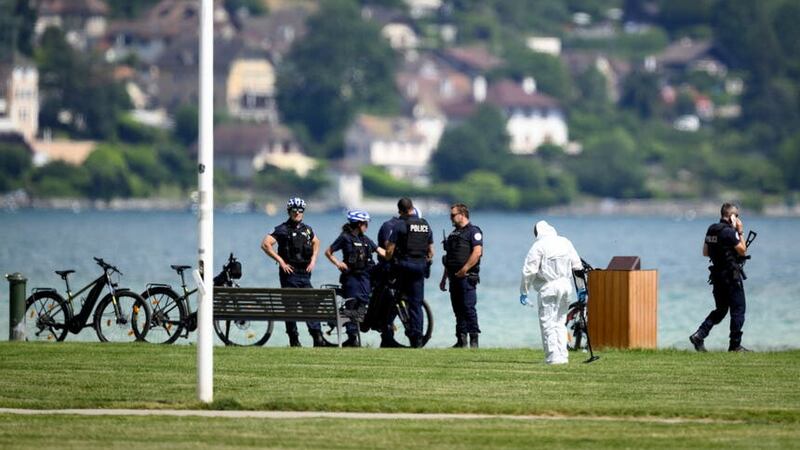 Security forces examine the scene of knife attack in Annecy. (Jean-Christophe Bott/Keystone via AP)